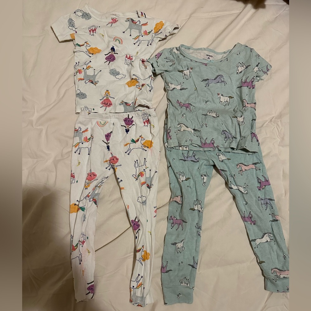 Pair of Carter’s pajama sets
Princess and unicorns